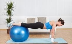 Woman performing stability ball exercise for neuromuscular re-education