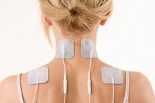 Electrode patches applied to neck and shoulders for physiotherapy